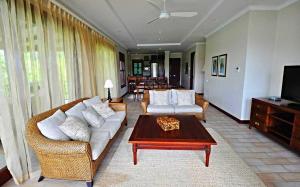 a living room with a couch and a coffee table at Eden Island, Beach front, Luxury, 3 Bed Ensuite, WiFi in Eden Island