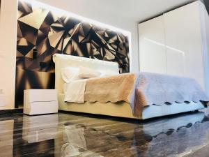 a bedroom with a bed and a large mirror at Loft Sirmione in Sirmione