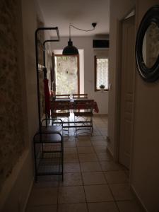 a dining room with chairs and a table and a mirror at Vieille Ville 2 - La Petite Maison à Safranier, 2 bedrooms, max 4 adults and 2 kids in Antibes