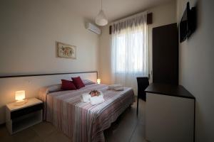 Postel nebo postele na pokoji v ubytování B&B Z'Angelina