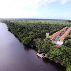 an aerial view of a river with a group of trees at Lençóis Ville Residence - CHALE 22 in Barreirinhas