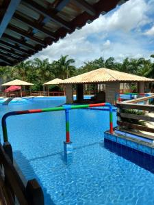 a water slide in a swimming pool at Pousada e Restaurante Lagoa Azul in Jijoca de Jericoacoara