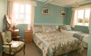 Un pat sau paturi într-o cameră la Murphys Farmhouse B&B