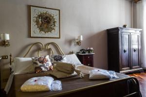Postel nebo postele na pokoji v ubytování Hotel Residenza In Farnese