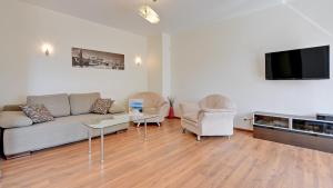 Telewizja i/lub zestaw kina domowego w obiekcie Dom & House - Apartments Parkur Sopot