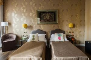 Postel nebo postele na pokoji v ubytování Hotel Residenza In Farnese