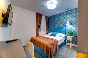 Postel nebo postele na pokoji v ubytování Hotel Skradinski Buk
