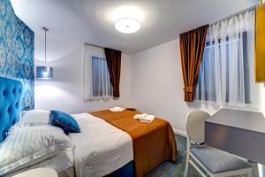 Postel nebo postele na pokoji v ubytování Hotel Skradinski Buk