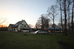 a house with a large yard in front of it at Ranna puhkemaja in Lemsi