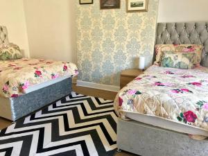 Ένα ή περισσότερα κρεβάτια σε δωμάτιο στο 233 Leith Apartment