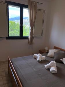 Een bed of bedden in een kamer bij Casa Vacanze Alcantara