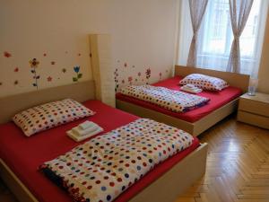Postel nebo postele na pokoji v ubytování Apartments Týnská 7