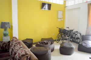 a living room with a couch and some bikes at Pavana Resort in Embilipitiya