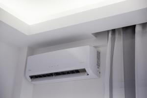 a microwave oven hanging from a ceiling in a room at Petite Palace Aristotelous 7 in Thessaloniki