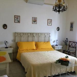 Cama ou camas em um quarto em I Girasoli di Migliarino