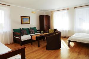 Postel nebo postele na pokoji v ubytování 4 STRONY ŚWIATA Pokoje i Apartamenty