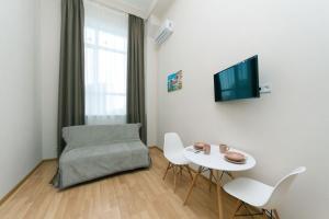TV a/nebo společenská místnost v ubytování FlatRent SmartHouse