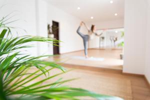 a woman dancing on a dance floor in a room at Ondina Guesthouse in Casais de São Lourenço