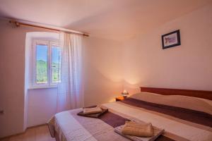 Postel nebo postele na pokoji v ubytování Apartment Surdić