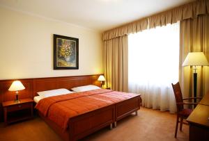 Postel nebo postele na pokoji v ubytování Hotel Matyšák + 33 fotografií