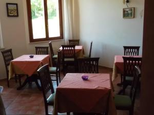 A restaurant or other place to eat at B&B Il Girasole