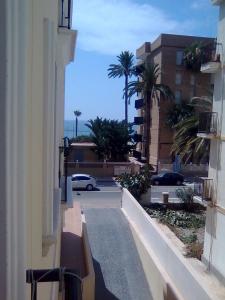 a view of a street from a building with palm trees at Apartamento en Águilas in Águilas
