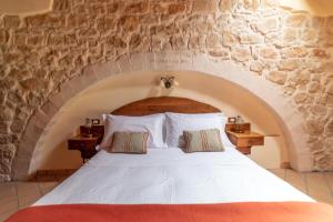 Letto o letti in una camera di Torre Don Virgilio Country Hotel
