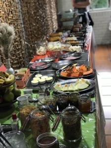 a buffet of food on a long table at Hotel Caracol in Canela