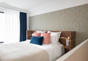 Postel nebo postele na pokoji v ubytování Hotel Parister Piscine & Spa