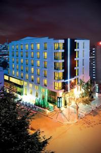 a large white building at night with at Demora Hotel in Ankara