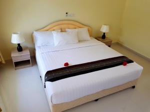 Postel nebo postele na pokoji v ubytování Karaa Village