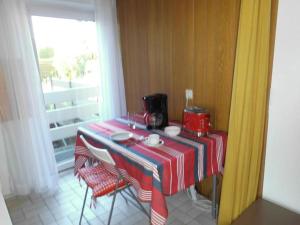 a table with a red and white table cloth on it at Haus der Kunst in Dülmen