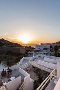 a view of a sunset from the roof of a building at Pension Alexandra Mykonos port in Mikonos