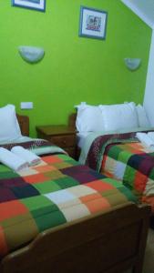 A bed or beds in a room at Residencial Moeda