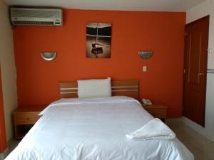 Postel nebo postele na pokoji v ubytování Libertad Hotel