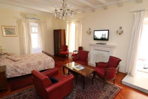 Televízia a/alebo spoločenská miestnosť v ubytovaní Antunini Studio Apartment