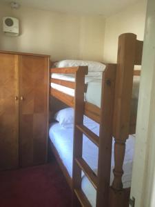 a couple of bunk beds in a room at Camellia Chalet in Germoe