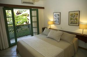 Cama ou camas em um quarto em Hotel 7 Colinas