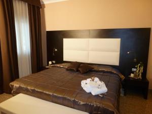 Postel nebo postele na pokoji v ubytování EH Suites Rome Airport Euro House Hotels