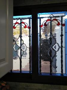 a pair of stained glass windows in a room at Precioso chalet en la playa de Tavernes de la Valldigna in Tavernes de Valldigna