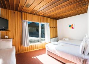 Postel nebo postele na pokoji v ubytování Eiger Chalet