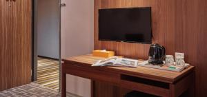 Televisyen dan/atau pusat hiburan di Orange Hotel - Wenhua, Chiayi