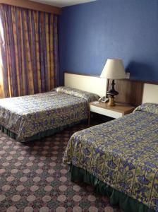 Un pat sau paturi într-o cameră la Hotel New York Ciudad de Mexico