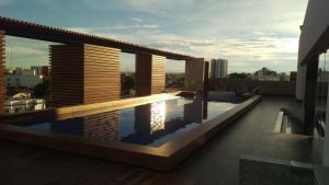 a swimming pool on the roof of a building at Departamento La Boutique in Santa Cruz de la Sierra