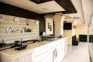 a hair salon with a counter and a mirror at Hotel Platinum in Kolkata