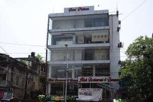 a building with a sign on the side of it at Hotel Platinum in Kolkata