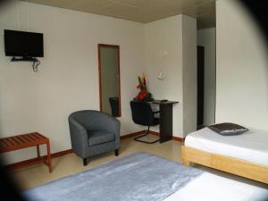 TV a/nebo společenská místnost v ubytování Champ de Mars B&B