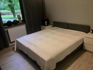 Posteľ alebo postele v izbe v ubytovaní Apartament SONIA