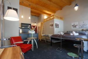 a room with a bed and a table and chairs at Hotel & Depandance Kopacka in Lanškroun