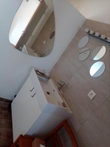 an overhead view of a bathroom with a mirror at La Grange de la Gandonnerie in Baugé-en-Anjou
